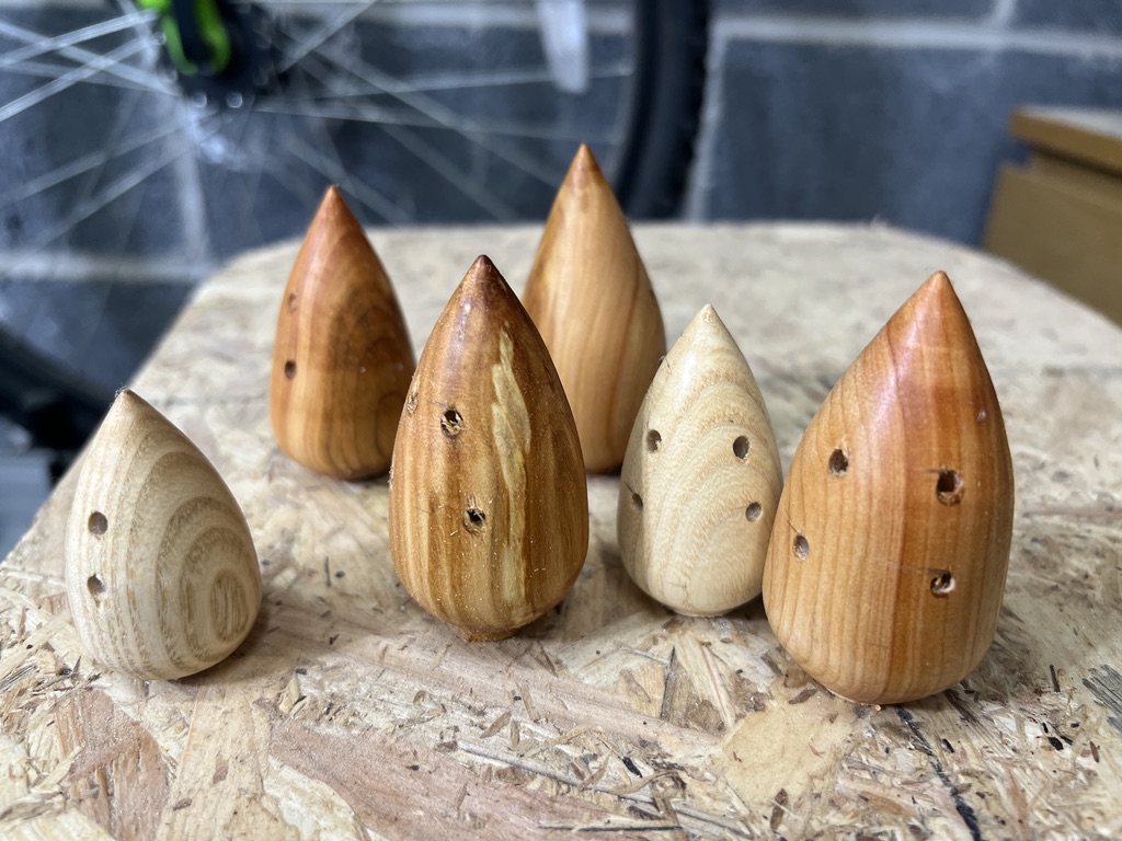 Several mouse blanks sanded and drilled in preparation for the next steps